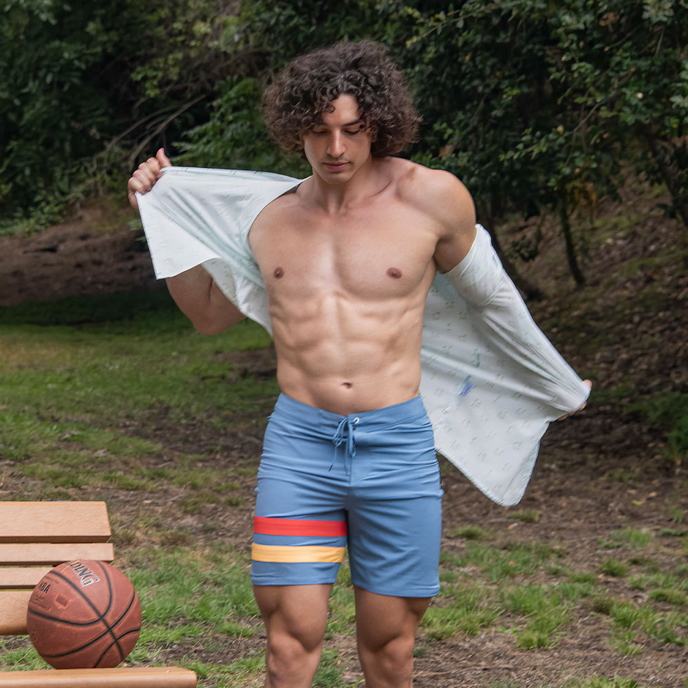 Charlie Santana Wearing Hurley Shirt and Shorts